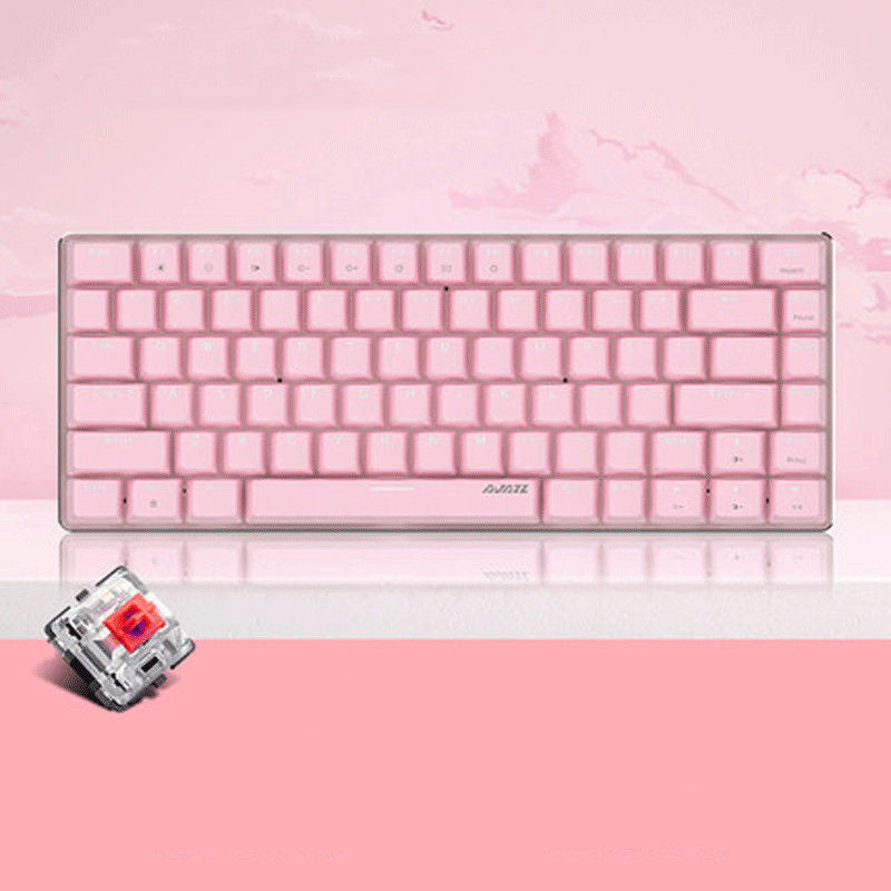 Pink keyboard on a pink background with a switch in the foreground