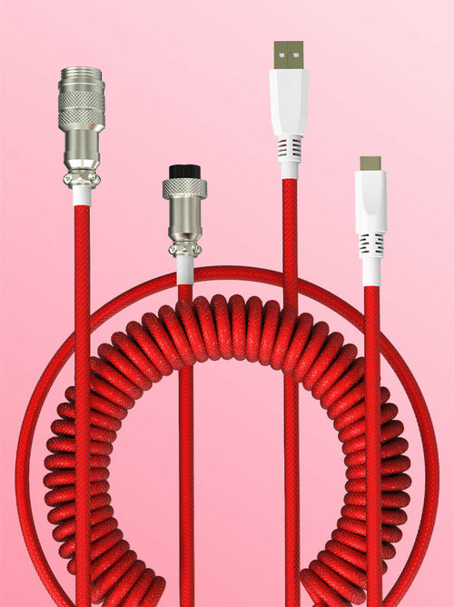 Red coiled cable with various connectors on a pink background